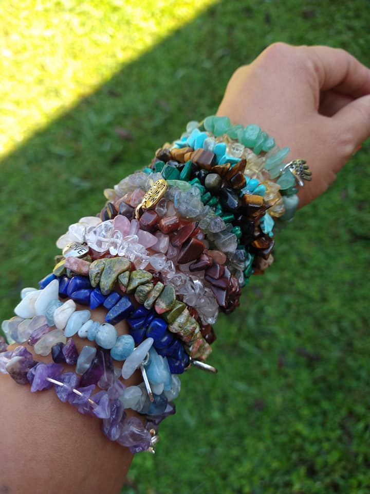 Arm displaying 17 different crystal bracelets