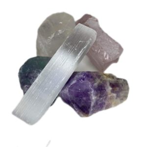 Crystal bundle with one selenite stick, one rose quartz rough cut crystal, one clear quartz rough cut crystal, one fluorite rough cut crystal and one rough cut amethyst crystal